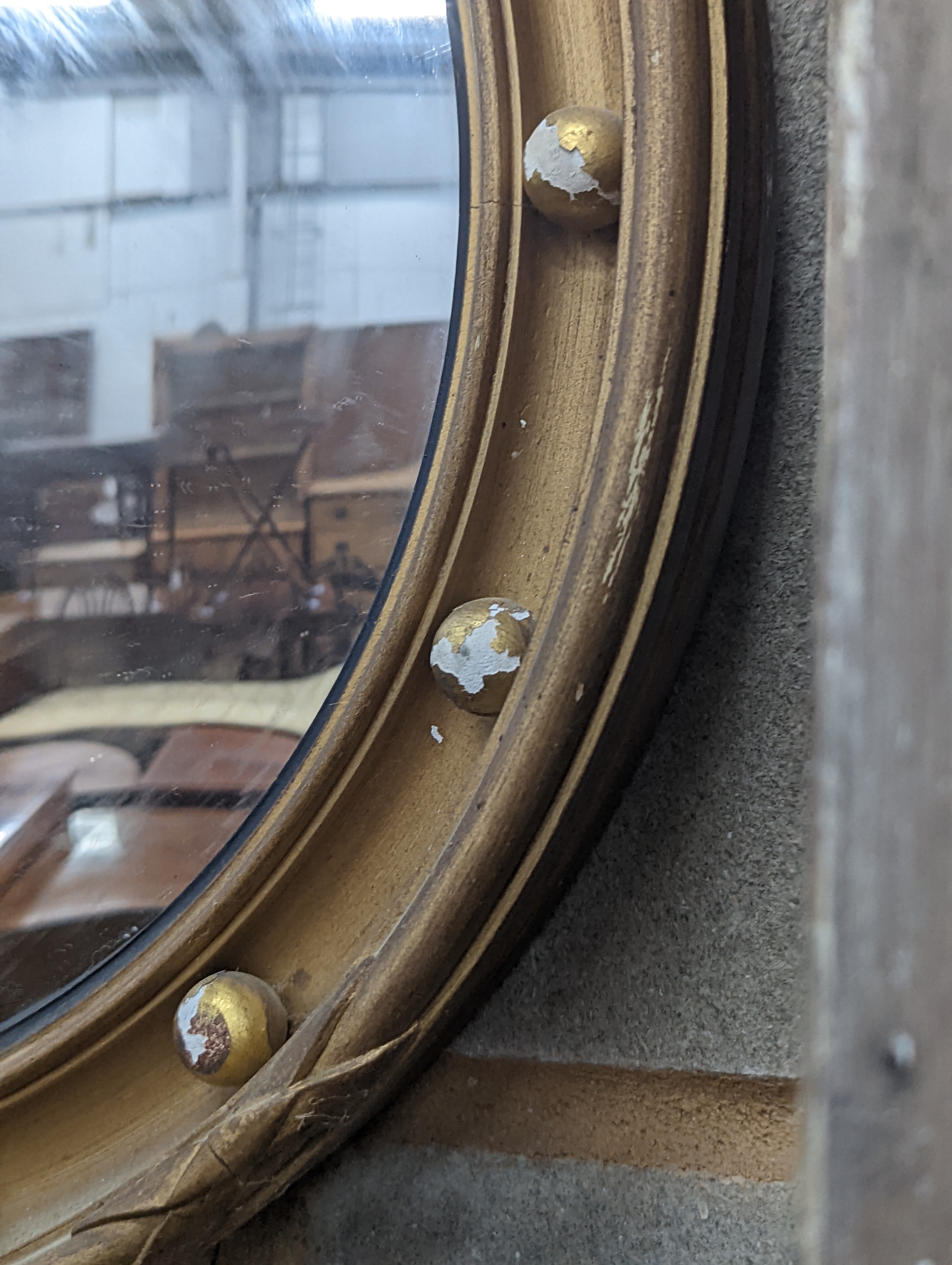 A Regency style circular gilt framed convex wall mirror, diameter 45cm